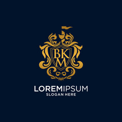Gold Ornate Monogram Logo with BK Initials on Dark Blue Background