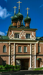 Holy Cross church above the gate, opened in 1857. Moscow, Russia