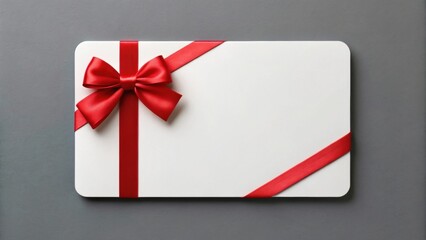 Blank white gift voucher and sale. Gift card wrapped in a red ribbon on a gray background.