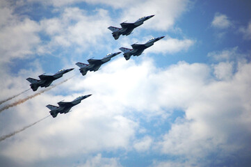 Military aircraft team flying wingover for show thai people foreign travelers and family and child...