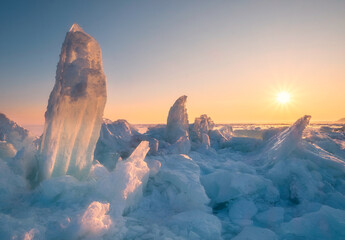 The sun rays illuminate a lake or northern sea covered with sparkling ice floes