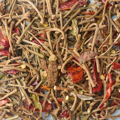 pile of cut off stems of dried chili peppers in full frame background, discarded food waste can be used as organic compost fertilizer or natural pest repellent or livestock feed