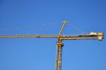 Asian labor people and thai labour workers use machine and heavy machinery working builder new structure tower high-rise building on scaffold at construction site at capital city in Bangkok, Thailand