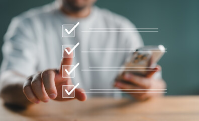 Quality control and check list, Businessman use pen to tick correct sign mark in checkbox for...