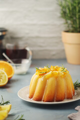 A sweet citrus cake served with oranges and lemons	