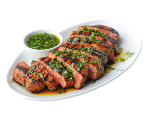 Grilled herb marinated pork tenderloin slices served with green sauce, showcasing delicious and appetizing presentation. Perfect for meat lovers and culinary enthusiasts
