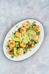 Delicious scallops with sauce.