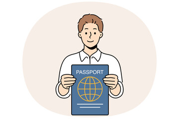 Man with international passport in hands that allows him to travel world and visit countries without obtaining visa. Smiling guy shows passport confirming right to tourism or residence in region