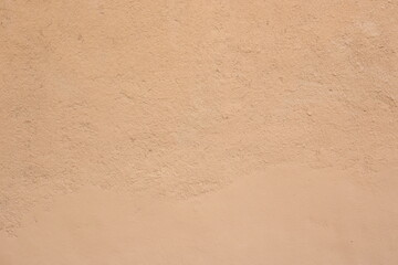 Texture of clay house structure. Wall of soil house. Mud background and vintage tone