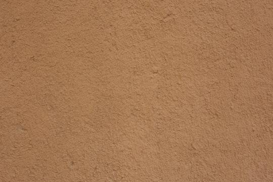 Soil wall texture of clay house structure. Mud background. 