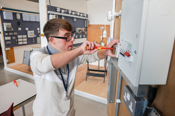 Man with Down Syndrome working in workshop