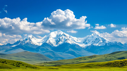 Fototapeta premium Majestic snow-capped mountains rise against a canvas of vibrant blue sky and fluffy white clouds, beckoning adventure and tranquility in a serene natural landscape