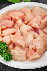 Chicken raw meat pieces of meat poultry tasty fresh delicious gourmet food background on table rustic food top view copy space keto and paleo diet