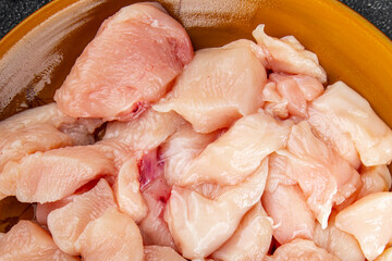 Chicken raw meat pieces of meat poultry tasty fresh delicious gourmet food background on table rustic food top view copy space keto and paleo diet