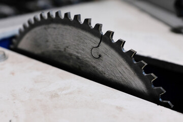 Tool for woodworking, circular saws with carbide brazing for cutting hard wood, close-up, image with copy space. Circular saw. Detail of worn circular saw teeth. Saw after cutting wood. 