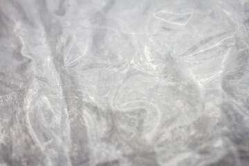 Extreme macro of plastic bubble wrap texture. Selective soft focus, shallow depth of field. Abstract dreamy background