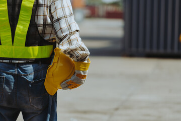 Close-up of a mechanic inspecting a forklift before it goes to work. © eakarat
