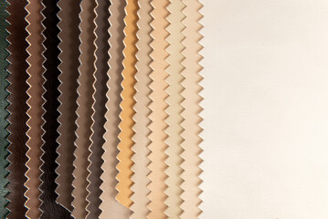 Palette of multi-colored pieces of genuine leather. Accessories for sewing. Leather material