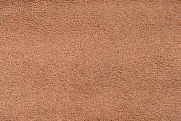 Texture of dense brown fabric for tailoring. Canvas. Textile. Material
