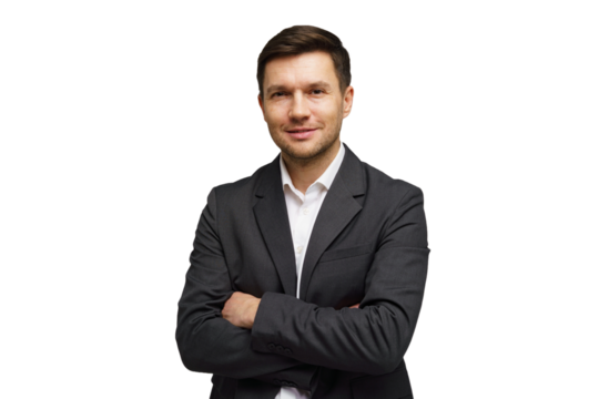 Professional man in a suit poses confidently with arms crossed, showcasing a friendly demeanor