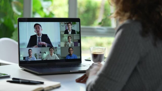 Online business video conference for internal team meeting and external meeting showing  business persons of multiple genders and ages on screen