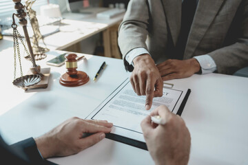 Business partners signing contract and reviewing details with lawyer in office, legal agreement...