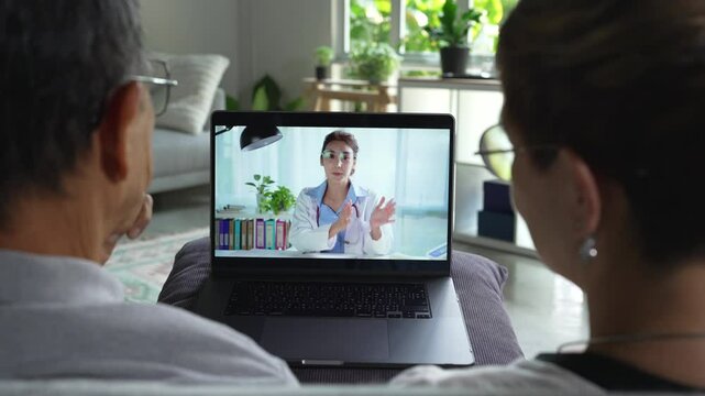 Senior couple have video call with doctor use wireless internet connection on laptop, Senior patient talk consult with physician online on webcam conference on computer