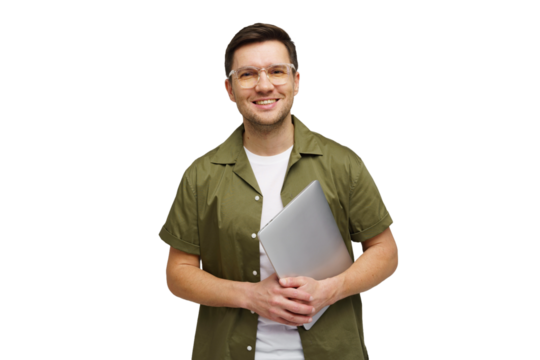 Professional man smiling while holding a laptop in a studio setting, showing confidence and readiness