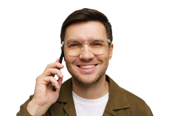 Young man in glasses smiling while talking on a smartphone against a plain background