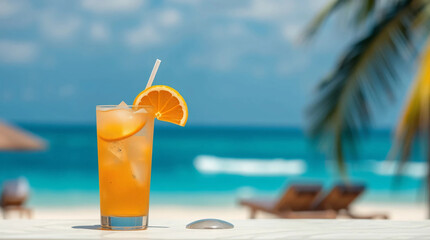Refreshing orange cocktail on beach table
