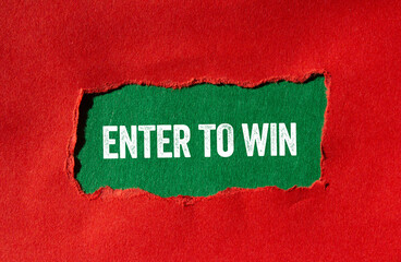 Enter to win message written on ripped torn red paper on green background. Conceptual enter to win...