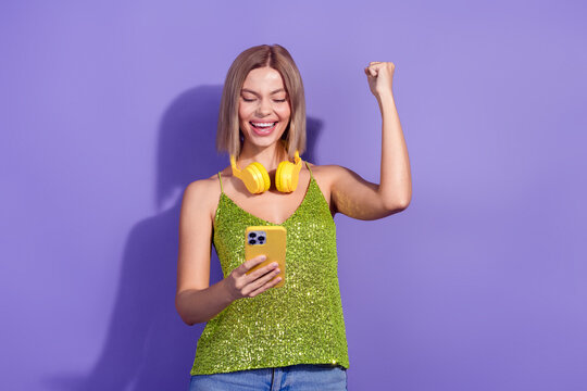 Photo of glad cute woman wear stylish sequins clothes win game isolated on purple color background - Powered by Adobe