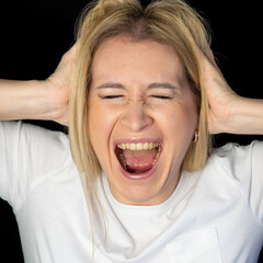 Young blonde woman standing over white background skeptic and nervous, disapproving expression on...