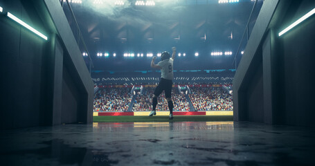 Caucasian American Football Player Walking Through a Dark Tunnel to a Big Outdoors Stadium Filled...