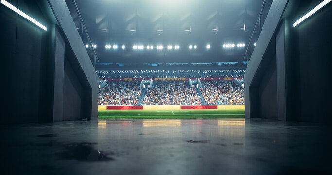 Photo Through a Tunnel Entrance to a Big Outdoors Stadium with Crowd Cheering and Awaiting for Favourite Teams to Walk Out And Play An Exciting Game. Stadium Filled with Energetic Sports Fans