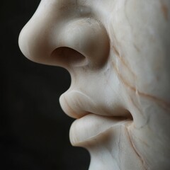Sculpted marble face fragment. Captures the nose and lips in exquisite detail, showcasing classical beauty. A timeless work of art.