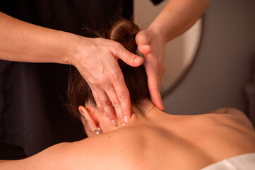 Relaxing neck and back massage, wellness massage concept. Close up of female massage therapist hands doing wellness medical relaxing massage in medical office. Copy text space of advertisement