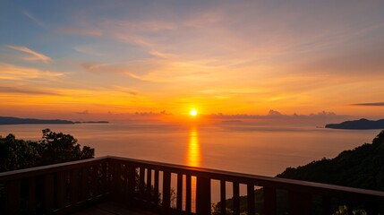 Obraz premium Vibrant sunset over water, stunning orange and purple hues reflecting on serene lake, perfect for relaxation and inspiration.