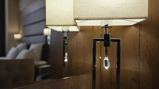 Warm light emanating from stylish lamps enhances the cozy ambiance of a contemporary hotel room