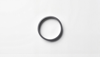 Minimalist silver circle symbol on monochrome background, elegant simplicity