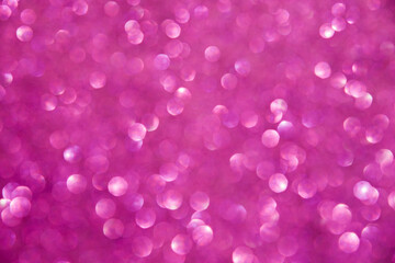 A soft pink bokeh-style background with unfocused light creates an elegant space for text or design elements.