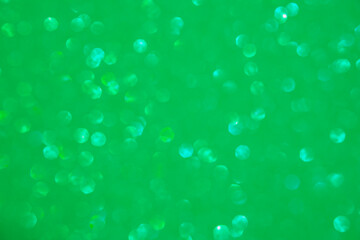 A light green bokeh-style background with defocused light creates an elegant space for text or design elements.