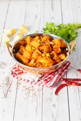 Aloo Phulkopir Dalna is a Bengali potato and cauliflower curry, cooked with spices, tomatoes, and ginger in a rich gravy.