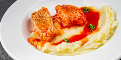 Fish dish tomato sauce and mashed potatoe tasty fresh gourmet food background table rustic food top view copy space