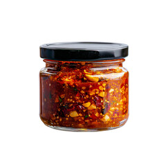 A glass jar filled with a rich, spicy condiment featuring a mix of red chilies, garlic, and other ingredients.