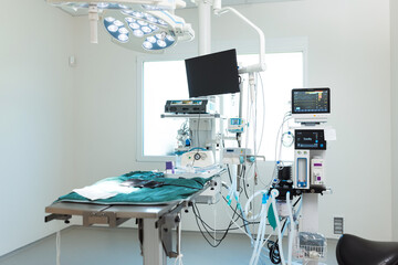 Empty sterile operating veterinary room with surgical instruments and table ready for operation