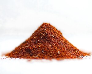 A small pile of spice powders against white background