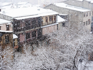 top view of urban courtyard in snowfall in winter