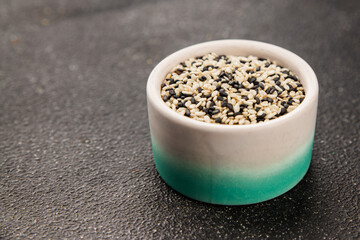 Sesame spice mix white and black tasty fresh gourmet food background on table rustic food top view copy space