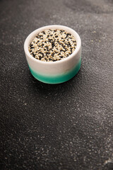 Sesame spice mix white and black tasty fresh gourmet food background on table rustic food top view copy space